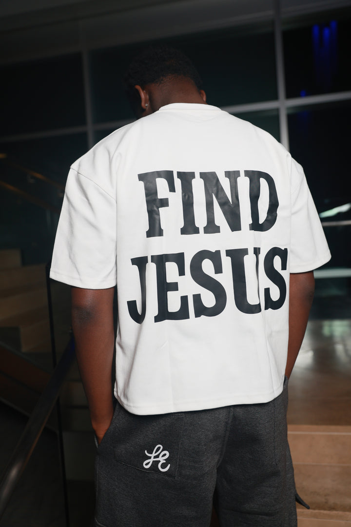 Person wearing a white sweatshirt with &