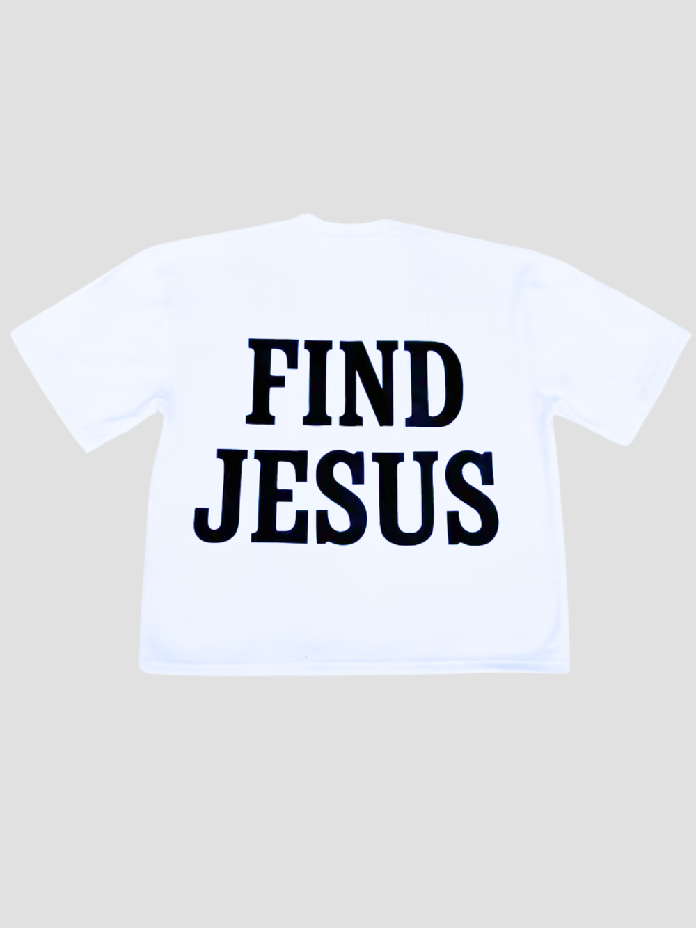 White t-shirt with 'Find Jesus' text on a beige background